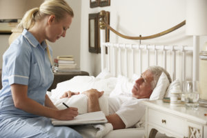 caregiver assessing her patient